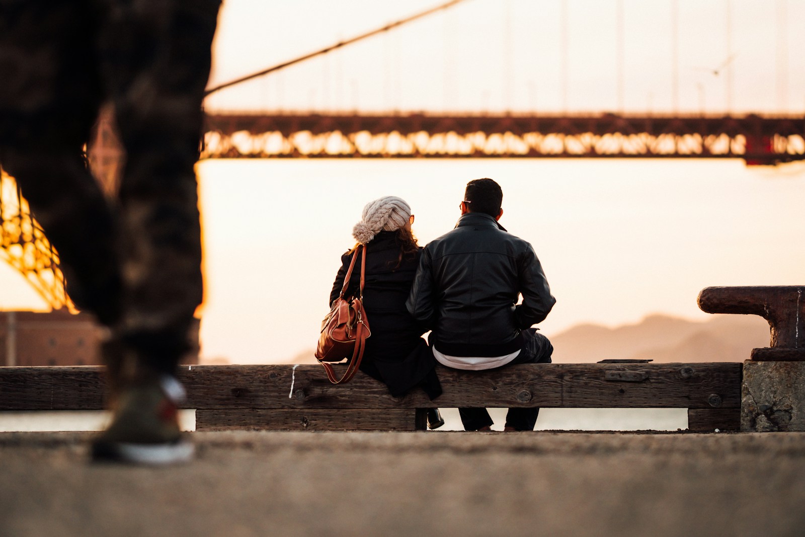 man sitting beside woman also sitting outside on a creative date night